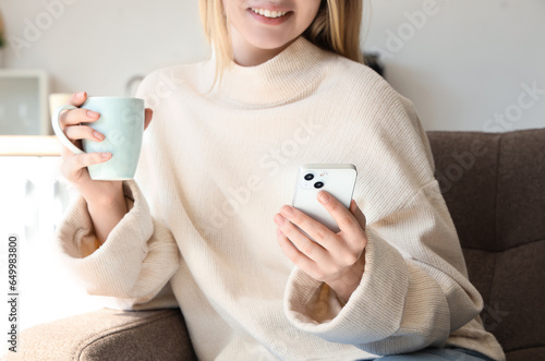 Young woman with cup of hot...