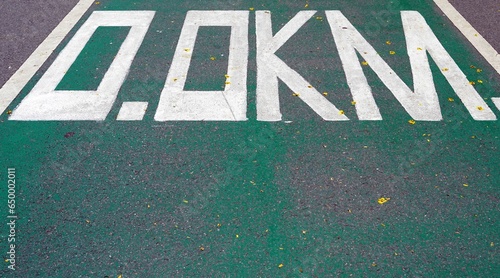 Parking sign on the asphalt of a bicycle lane start mark to 0.0KM, sport concepts. photo