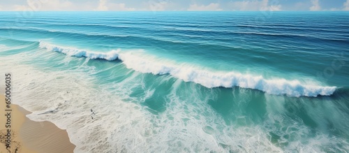 Beach view from above with ocean and waves © AkuAku