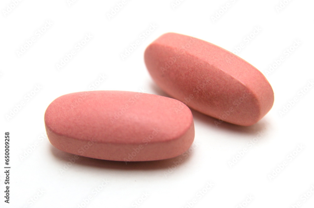 several vitamin B complex pills macro isolated on white Background several vitamin B complex pills macro isolated on white Background