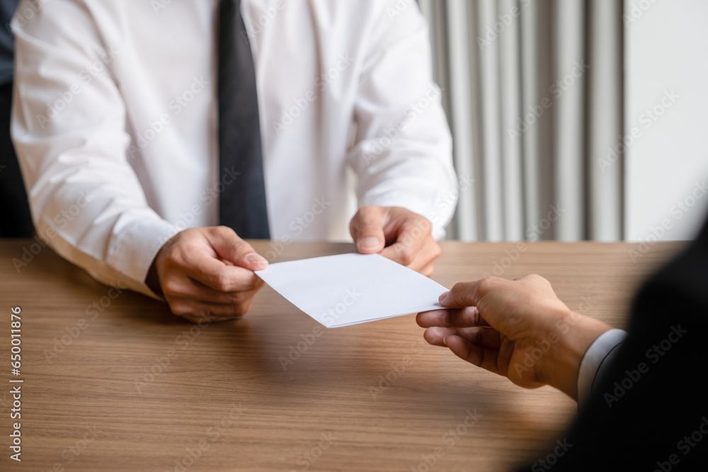 Businessman give resignation letter to boss. Businessman give resignation letter to boss.