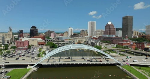 Rochester city downtown with cars driving on Frederick Douglass Susan B. Anthony Memorial Bridge over Genesee River in upstate New York. Urban architecture in the USA photo