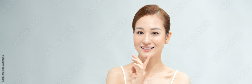 Beautiful young asian woman with clean fresh skin on web banner Beautiful young asian woman with clean fresh skin on web banner
