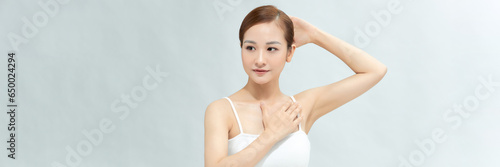 Armpit epilation, lacer hair removal. Young woman showing clean underarms. Banner