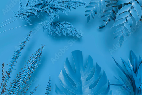 Collection of tropical leaves,foliage plant in blue color with space background

