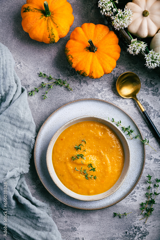 Pumpkin soup with pumpkin seeds served in bowl Pumpkin soup with pumpkin seeds served in bowl
