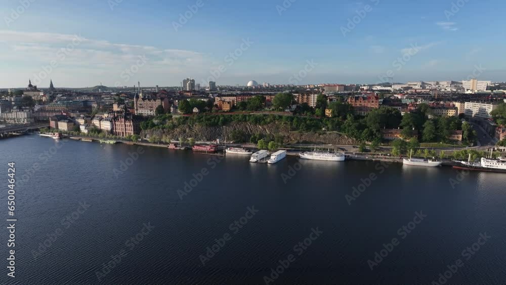 Rocky scenic spot and river with boat hotels in Stockholm, Sweden. Drone cityscape, travel destination. Rocky scenic spot and river with boat hotels in Stockholm, Sweden. Drone cityscape, travel destination.