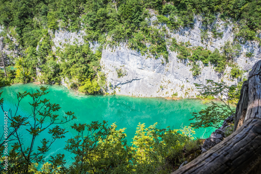 View of the beautiful clear blue Plitvice Lakes. Rocks and green trees around lakes with blue water. Breathtaking view in the Plitvice Lakes National Park .Croatia