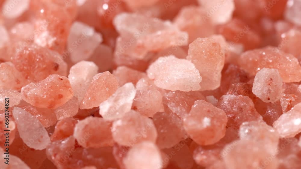 Scrolling video of pink rock salt. Close-up. Scrolling video of pink rock salt. Close-up.