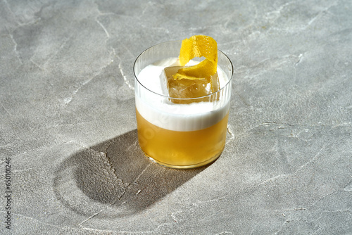 Whiskey sour cocktail with foam in a glass. Bar menu photo