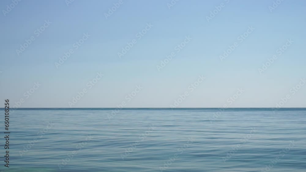 Aerial panoramic view of beautiful sunset above sea. Beautiful seascape. Sun glare, small waves on the water surface. Evening. Horizon. Nobody. No people. Never-ending beauty of nature. Aerial panoramic view of beautiful sunset above sea. Beautiful seascape. Sun glare, small waves on the water surface. Evening. Horizon. Nobody. No people. Never-ending beauty of nature.