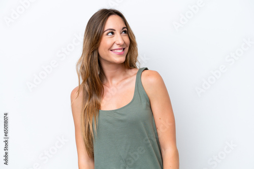 Young caucasian woman isolated on white background thinking an idea while looking up