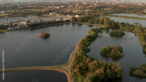 Pan up aerial shot from Walthamstow wetlands towards Central London photo