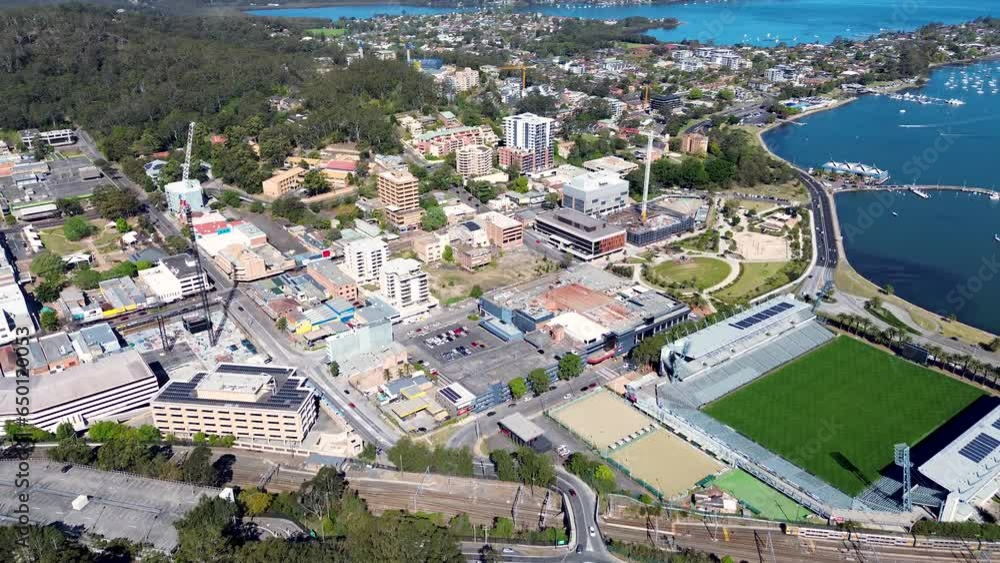 Aerial view of a stadium and waterfront cityscape used as a visual metaphor for watching Texas Tech QB Hammond from a broader perspective
