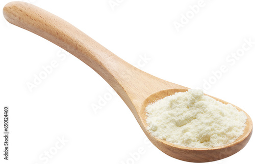 Wooden spoon filled with milk powder photo