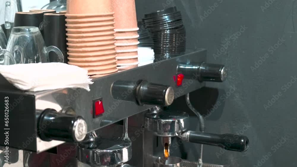 Professional coffee machine making hot espresso shot or americano in ...