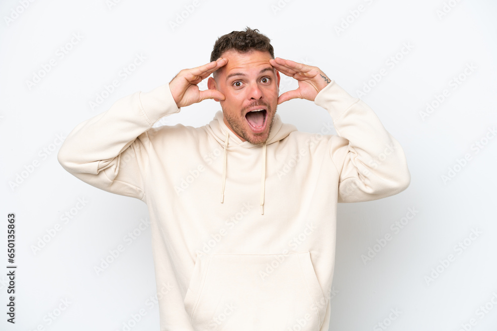 Young caucasian handsome man isolated on white background with surprise expression Young caucasian handsome man isolated on white background with surprise expression