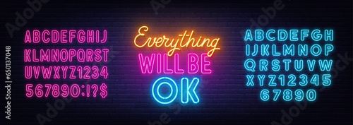 Everything Will Be Ok neon lettering on brick wall background.