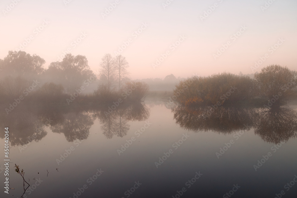 Autumn foggy landscape over the lake Autumn foggy landscape over the lake