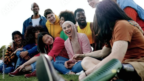 Multicultural group of friends having fun together outdoor - Diversity and multiethnic community concept