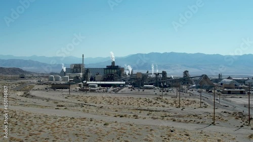 Power plant in the desert with smoke stacks and mountains Trona California photo