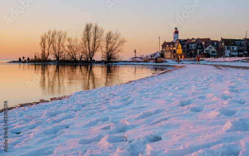 Lighthhouse of Urk Netherlands during sunset in the Netherlands photo