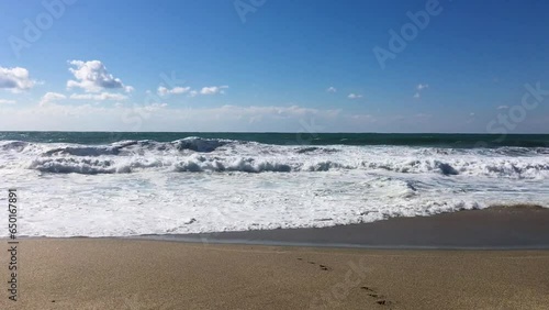 Waves on the sea, view from the sandy beach, high sound quality