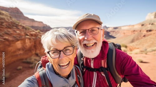 European senior tourist couple, immersed in the beauty of picturesque desert canyons, mountains, and the sky. Exploring the desert wonders together. Generative ai © makstorm