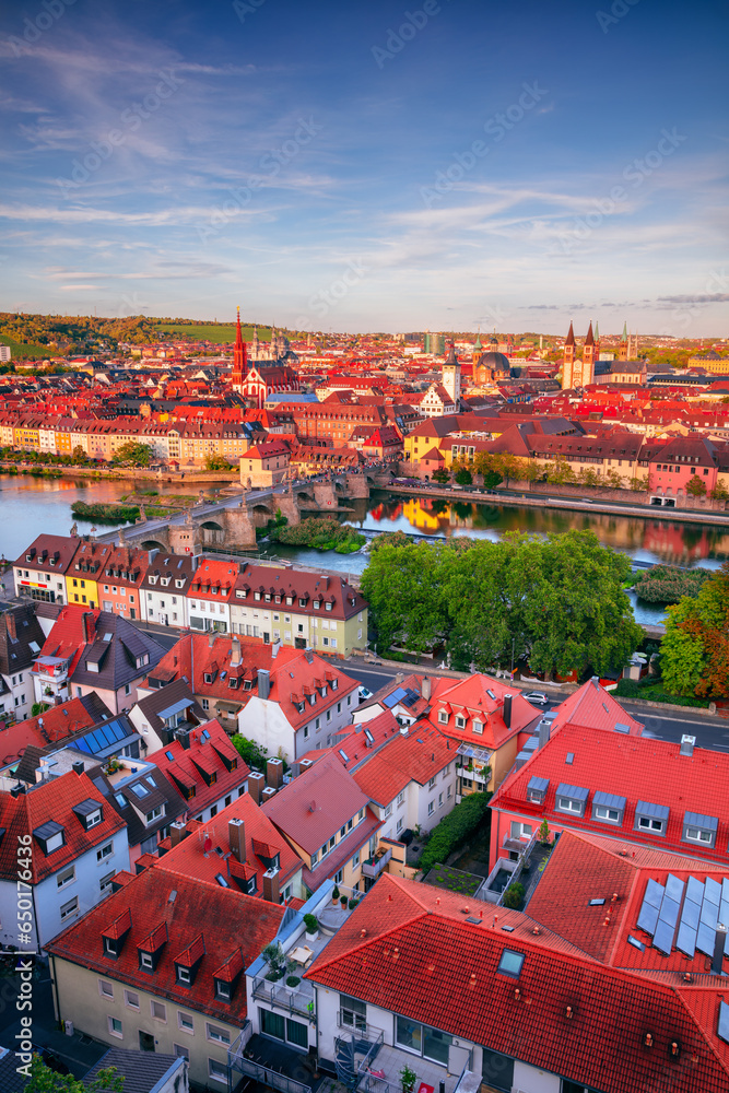 Wurzburg, Germany. Aerial cityscape image of Wurzburg with Old Main Bridge over Main river during beautiful autumn sunset.