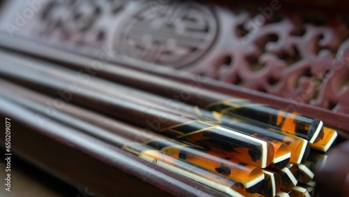 Taking Decorative Chopsticks from Ornate Wooden Box Close Up