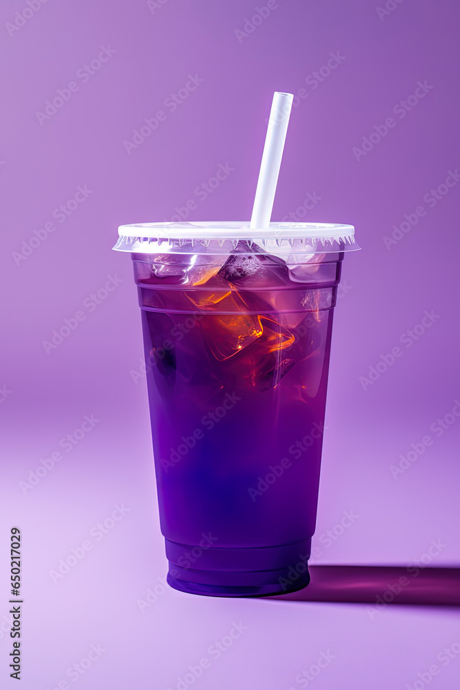 Purple drink in a plastic cup isolated on a purple background. Take away drinks concept Purple drink in a plastic cup isolated on a purple background. Take away drinks concept
