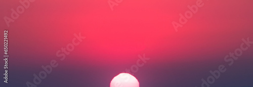 Bright red sunrise. Wide photo.
