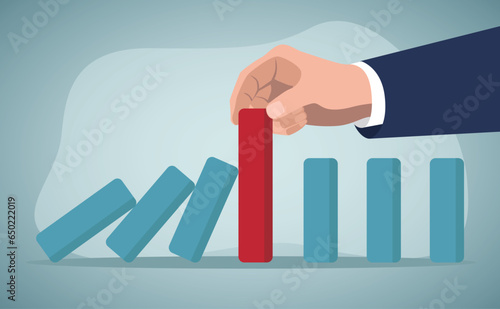 Risk management, control danger, lost or damage from crisis or accident, management and investment strategy, insurance concept, businessman stop risk of domino effect from threats and disaster.