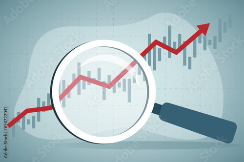 Using magnifying glass to look at rising stock market data