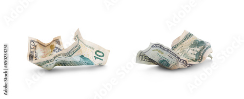 Obraz na płótnie A collection of American dollars lying on the ground after being thrown away, wasting money, isolated against a transparent background. w salonie