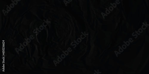 Black paper texture is crumpled paper texture. Black crumpled and creased paper texture. Black crumpled blank paper texture. Grunge paper texture.