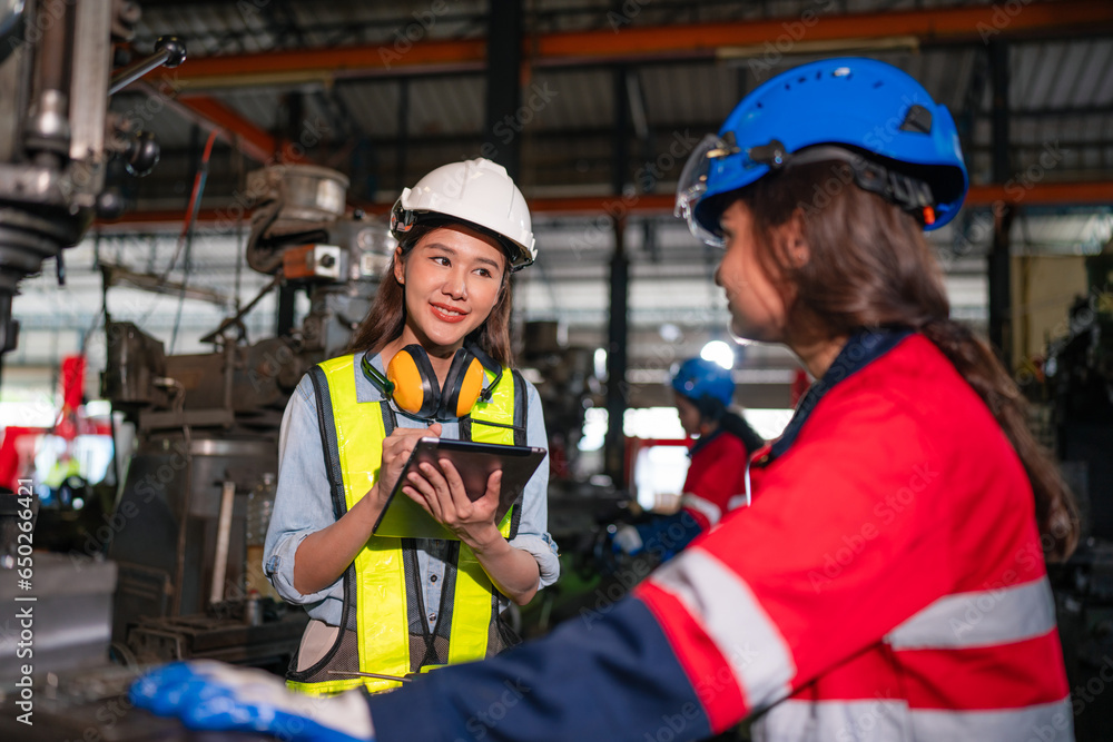 Obraz premium Mechanical engineering team production. Industry manufacturing women engineer worker skills quality, maintenance, training industry factory worker.