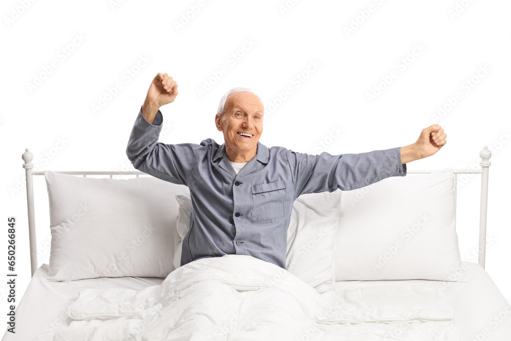 Happy elderly man stretching in a comfortable bed Happy elderly man stretching in a comfortable bed