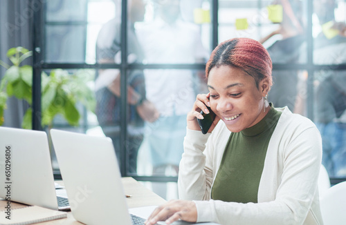 Mobile Communication Concept. Portrait Black Female Talking On Cellphone Working On Pc in Office