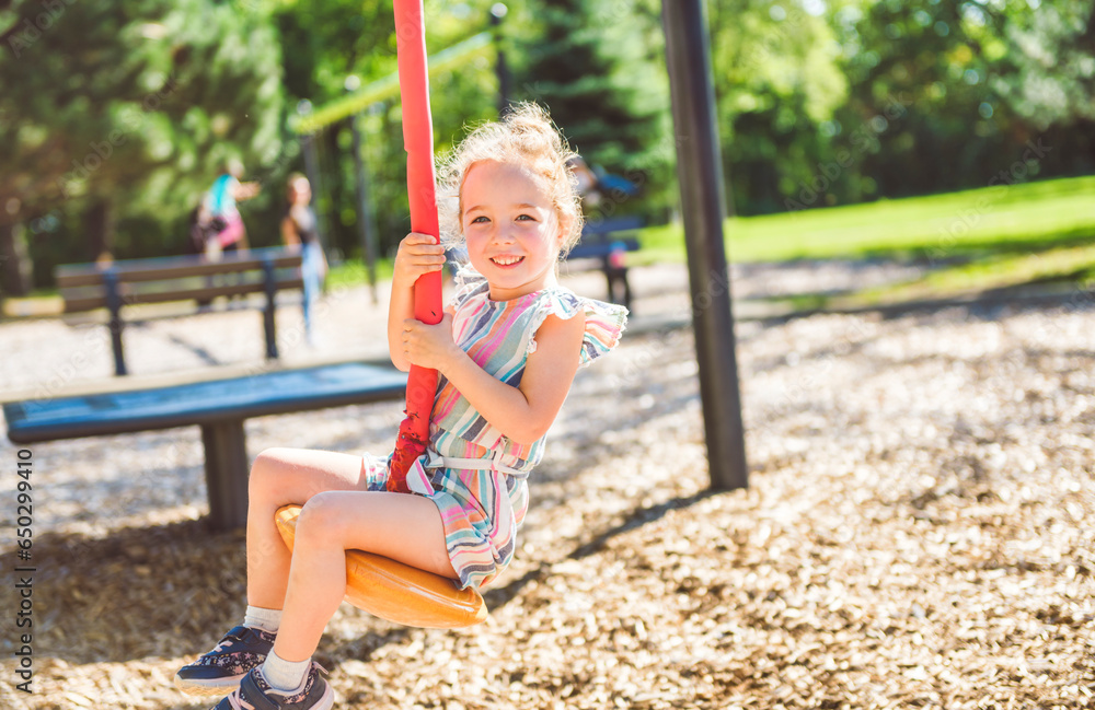 Happy kid on playground on summer season Happy kid on playground on summer season