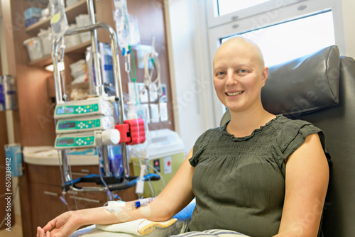 Young woman in hospital bed suffering from breast cancer receiving treatment photo