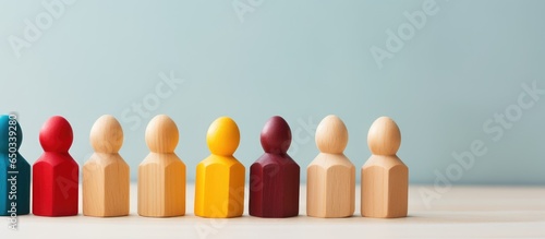 Diversity and inclusion expressed through colorful wooden figures