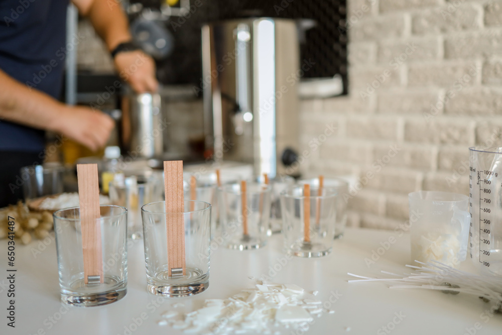 Master makes candles in the workshop