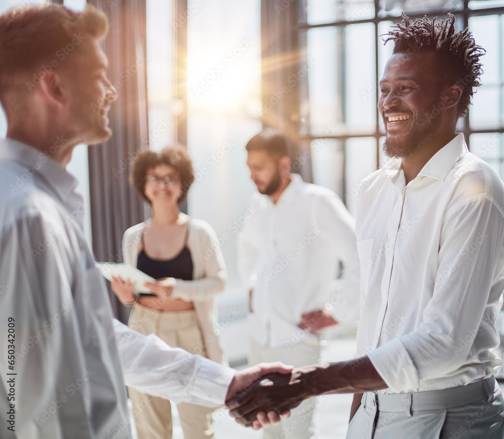 Fototapeta premium Congratulating the new partners in modern office