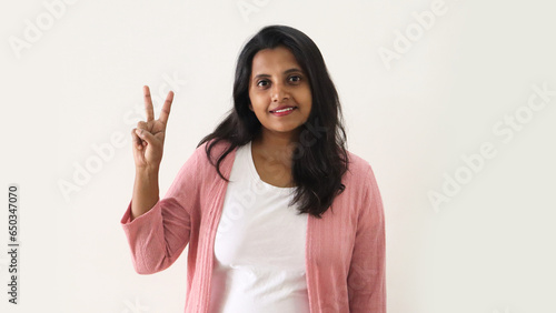 Indian women showing two finger using her hand