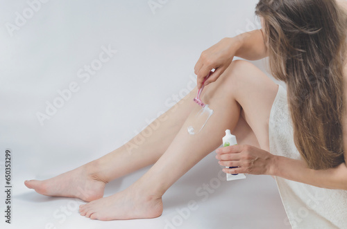 Safety Razor Shaving Women Legs on white background