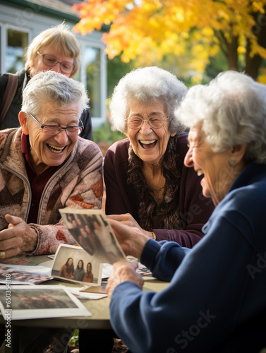 A Photo of Seniors Laughing and Reminiscing Over Old Photos on an Autumn Afternoon