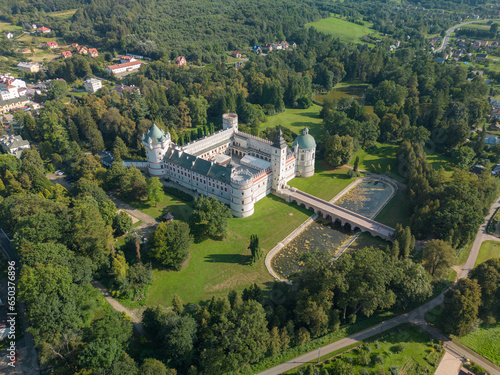 Krasiczyn, Subcarpathian, Poland - 21 August 2023: Renaissance palace complex in Krasiczyn with adjacent English park and moat photo