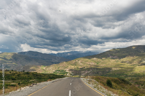 The road to the mountains under the clouds. Road Lagich - Pirkuli. Southern slopes of the Greater Caucasian Range. Azerbaijan nature. photo