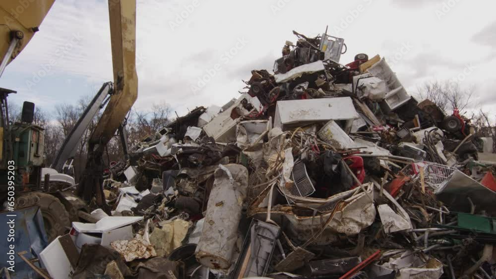 Junkyard junk pile with excavator and backoe Junkyard junk pile with excavator and backoe
